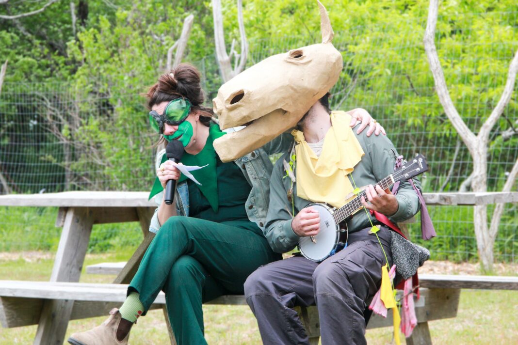 people in animal costumes playing a banjo